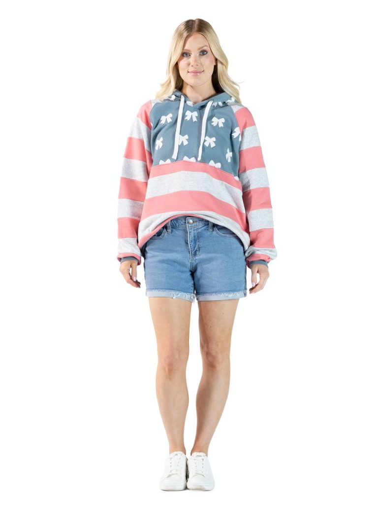 Model wearing Simply Southern bow print pullover hoodie with striped sleeves and drawstring hood