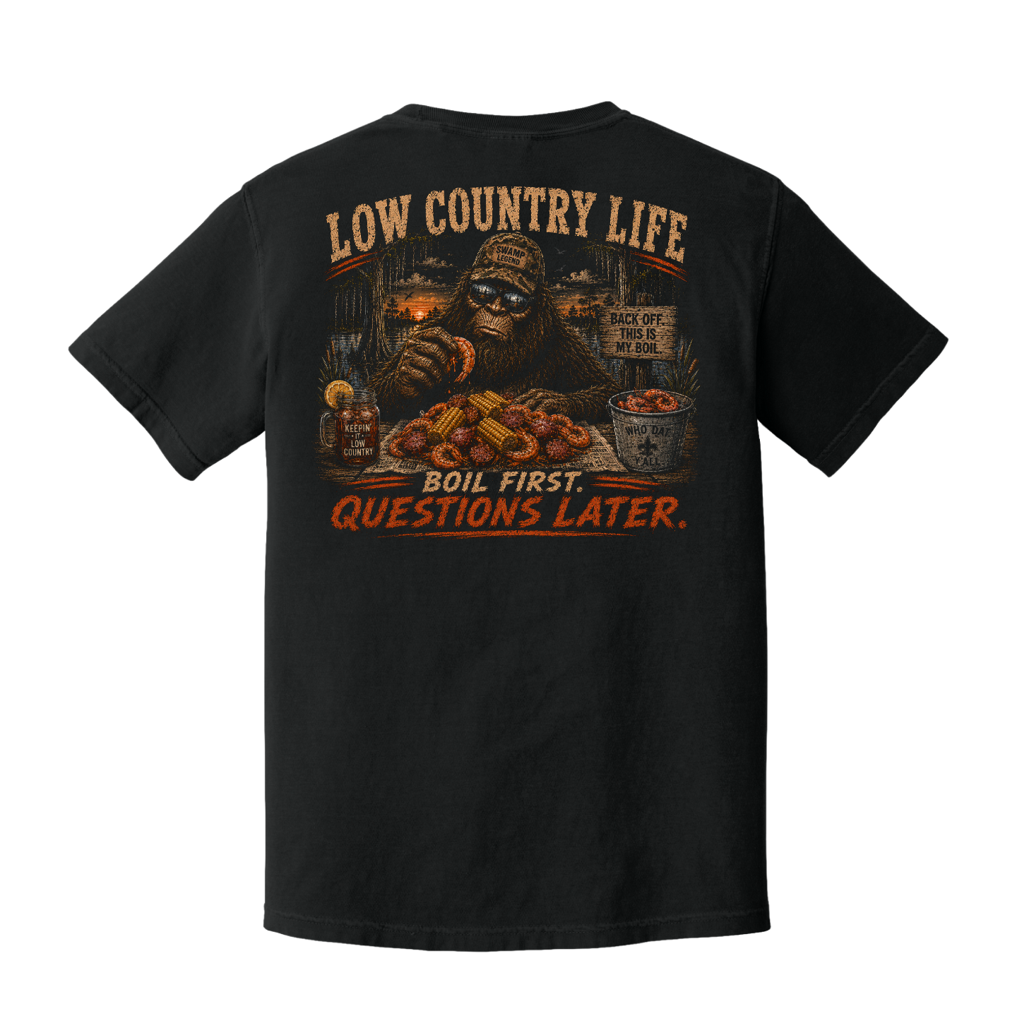 Back of Black Comfort Colors t-shirt featuring Bigfoot at a Low Country crawfish boil with the words "Boil First, Questions Later."