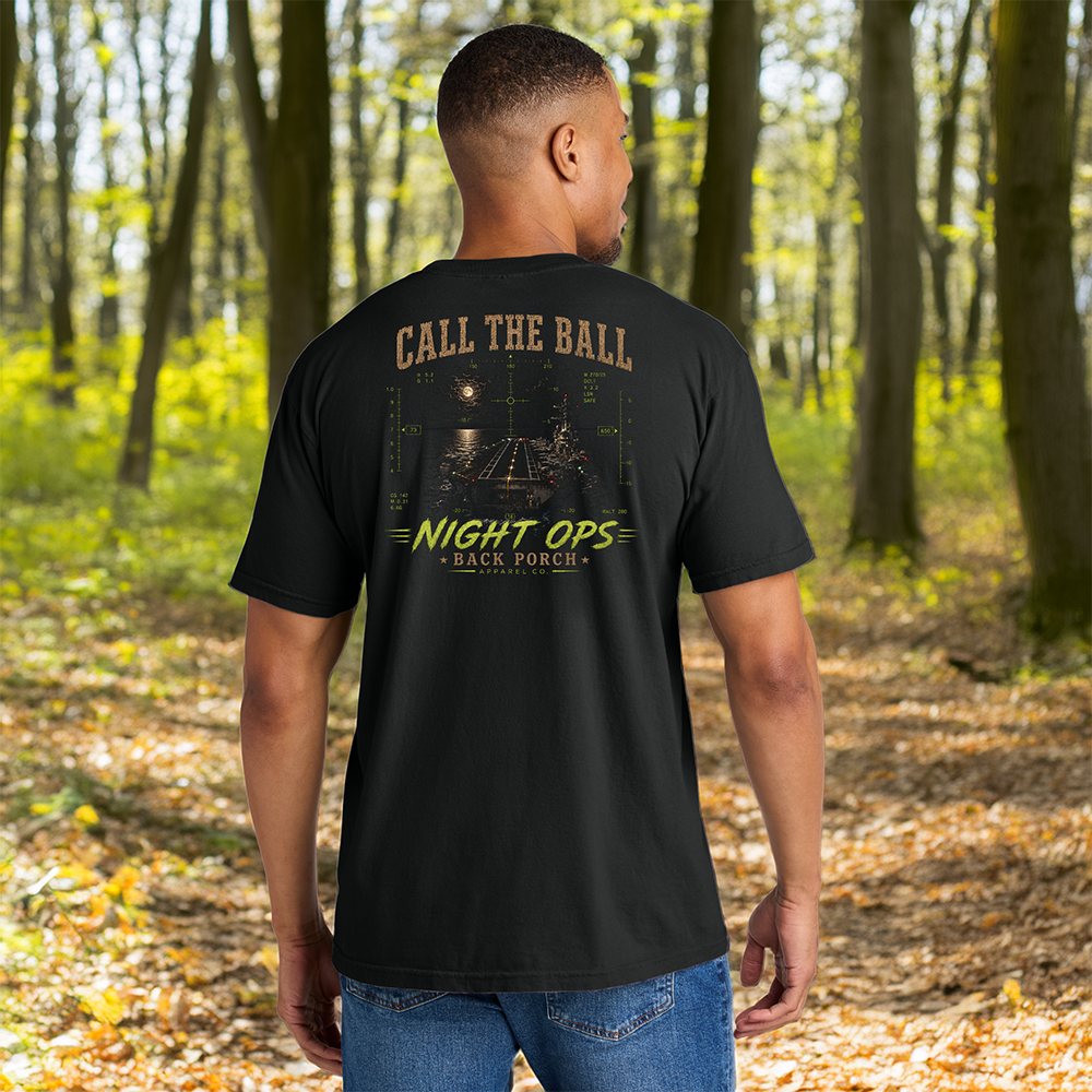 Model wearing a Back Porch Apparel Call The Ball Night Ops Comfort Colors T-Shirt