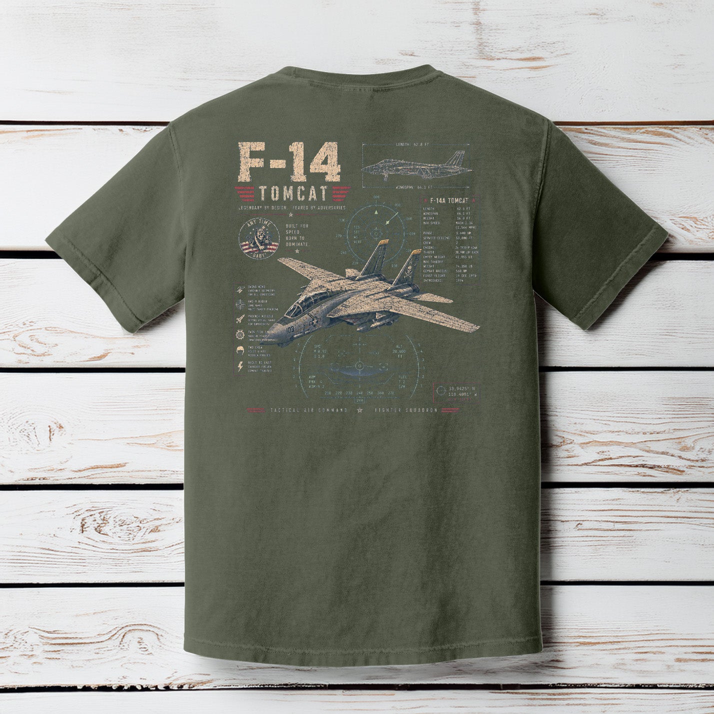Moss Comfort Colors t-shirt hanging on a wood background featuring a distressed F-14 Tomcat military aviation schematic design.