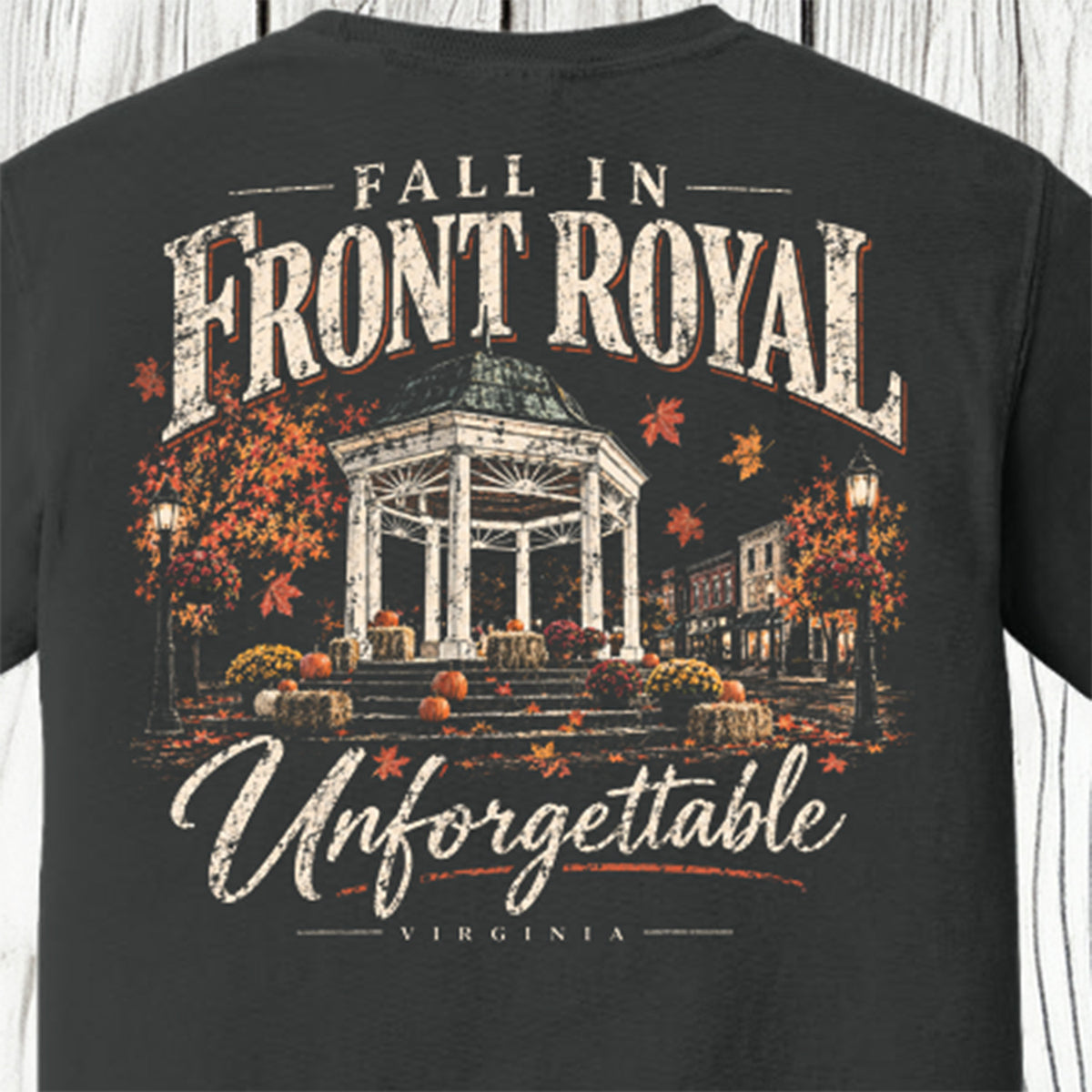 Close-up of the Fall in Front Royal Unforgettable Virginia shirt design featuring the Front Royal gazebo surrounded by fall leaves and pumpkins.
