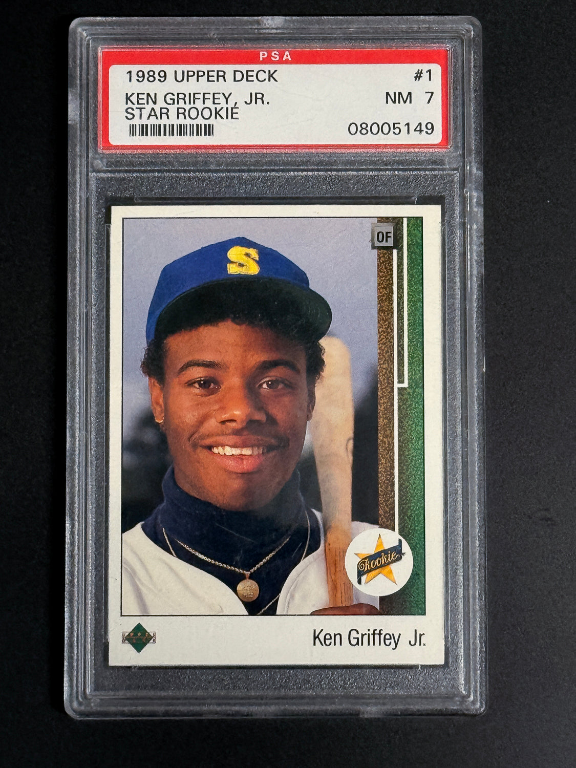 1989 Upper Deck Ken Griffey Jr. Star Rookie baseball card graded PSA 7, showing Griffey smiling in Seattle Mariners uniform