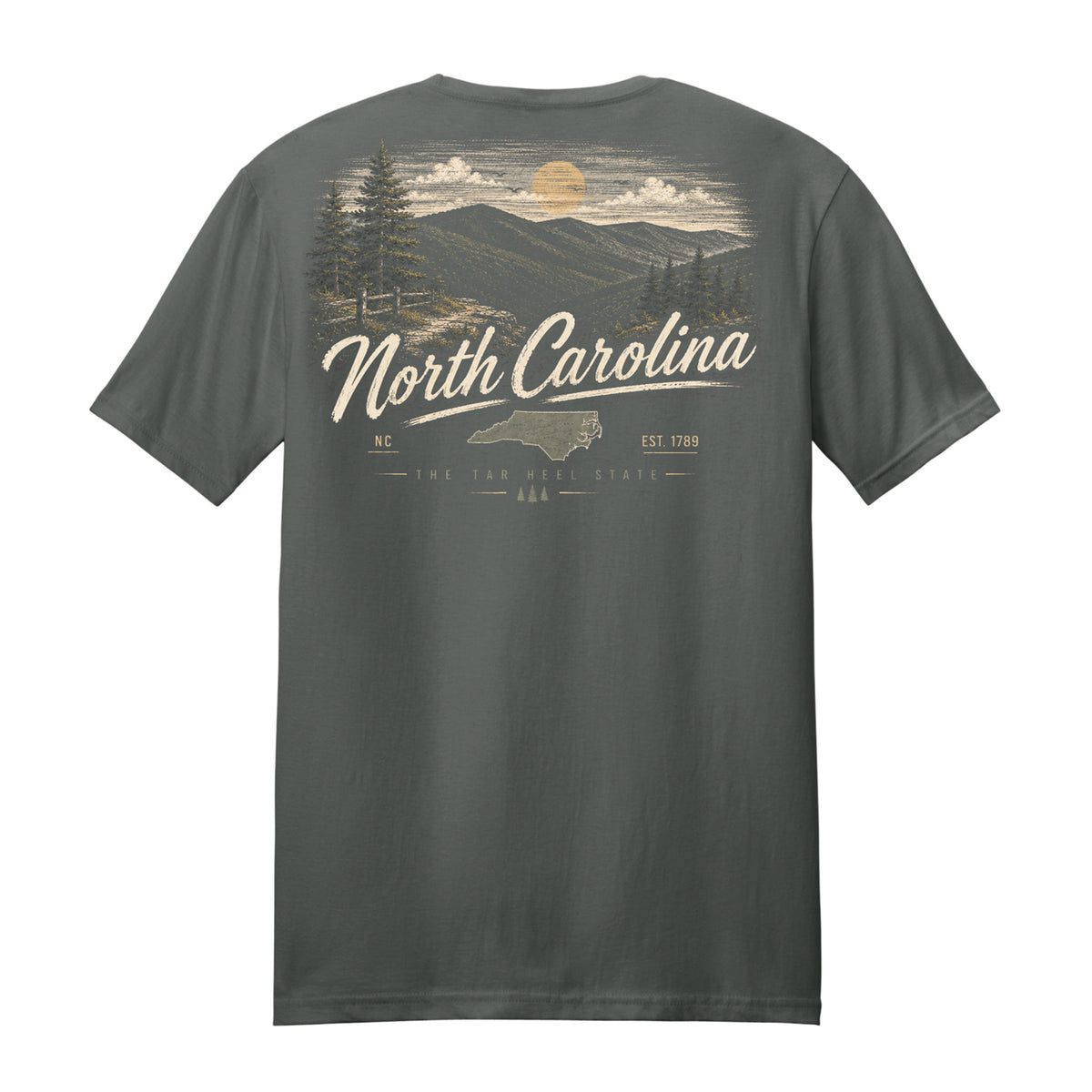 A dark gray short-sleeve t-shirt showing the back graphic, which features a scenic North Carolina landscape with mountains, pine trees, a sun, and the text 'North Carolina' in a cream-colored script.