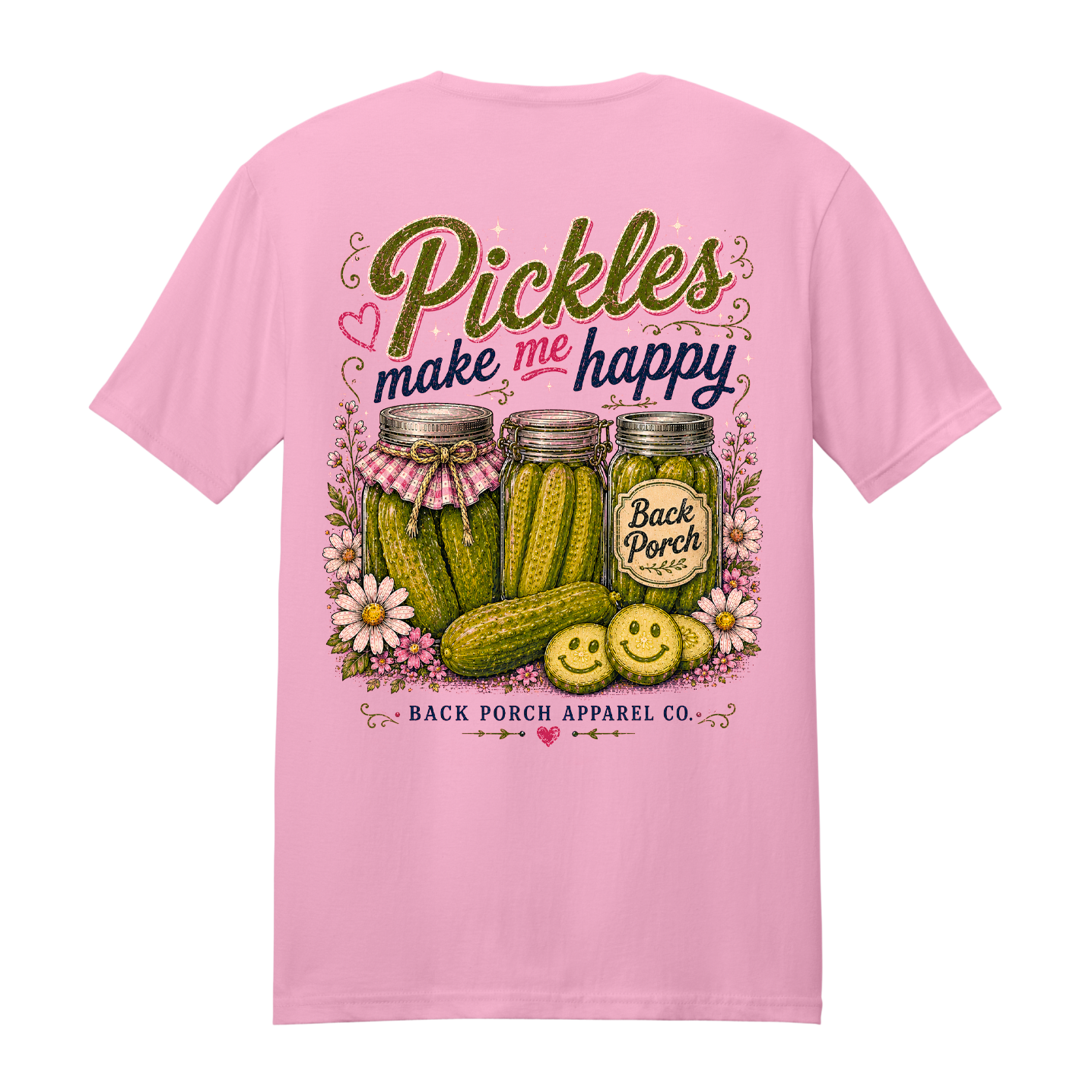 Pink 100% ring-spun cotton t-shirt with "Pickles Make Me Happy" back graphic featuring pickle jars, smiling pickle slices, floral accents, and rustic typography by Back Porch Apparel.