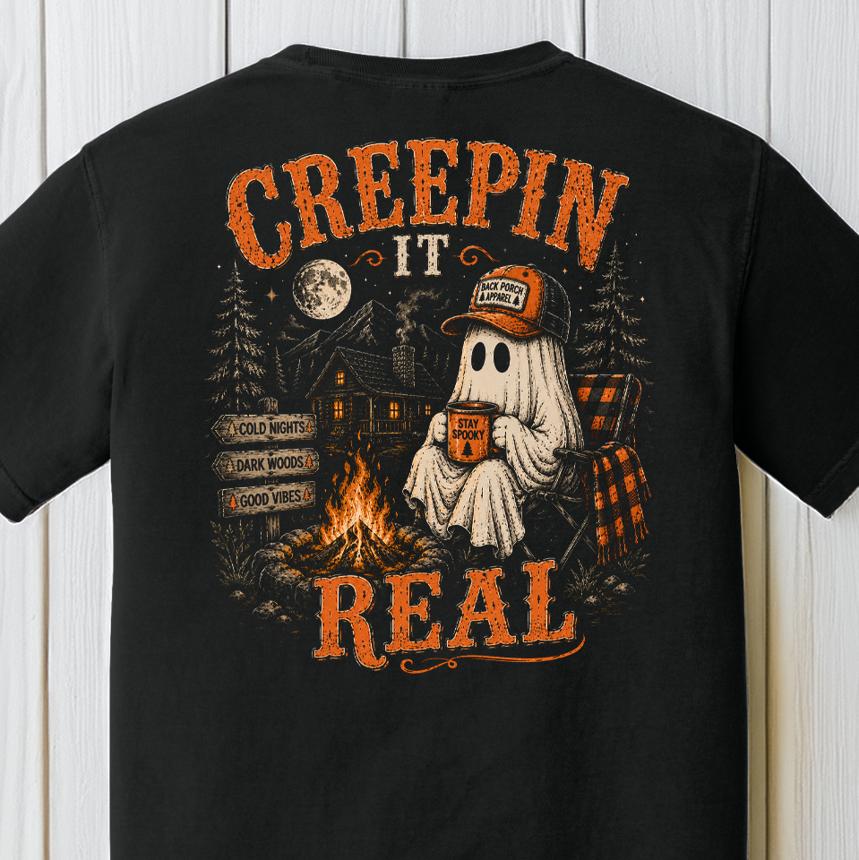 Creepin' It Real Comfort Colors Halloween shirt with ghost, campfire, mountain cabin and dark woods design