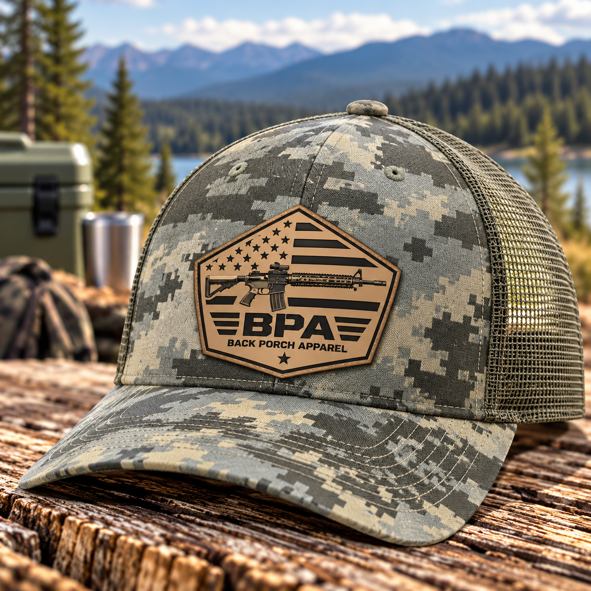 Back Porch Apparel tactical rifle and American flag light tan leather patch on a gray digital camouflage Richardson 112PFP trucker hat with olive mesh back.