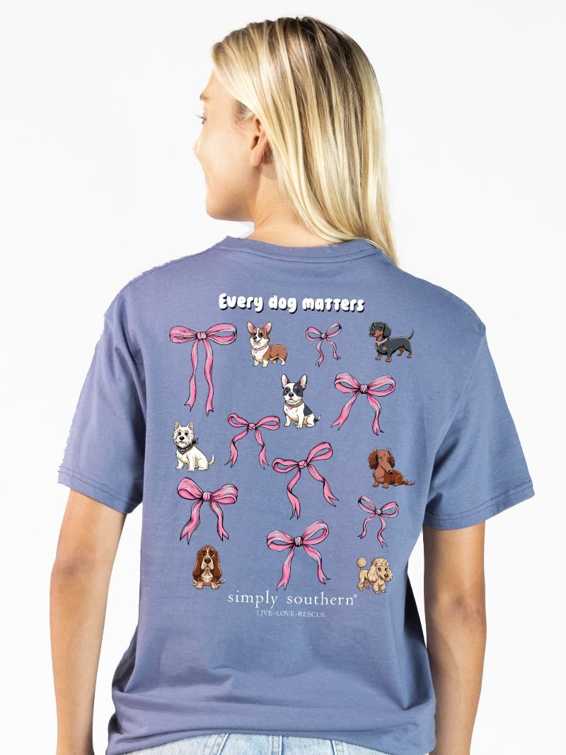Simply Southern Every Dog Matters denim blue short sleeve cotton tee with dog illustrations and pink bow graphics