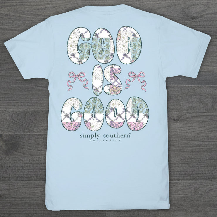 Simply Southern ice blue short sleeve t-shirt with floral “God Is Good” text and pink bow accents on back