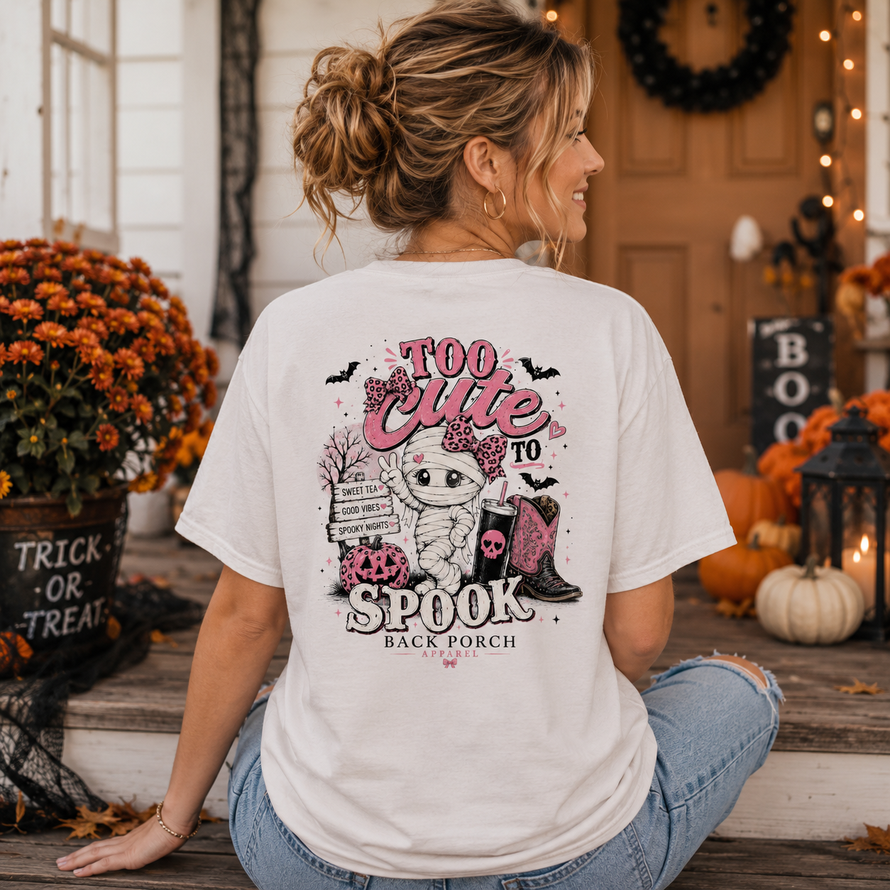 Woman wearing a Too Cute To Spook Back Porch Apparel Shirt