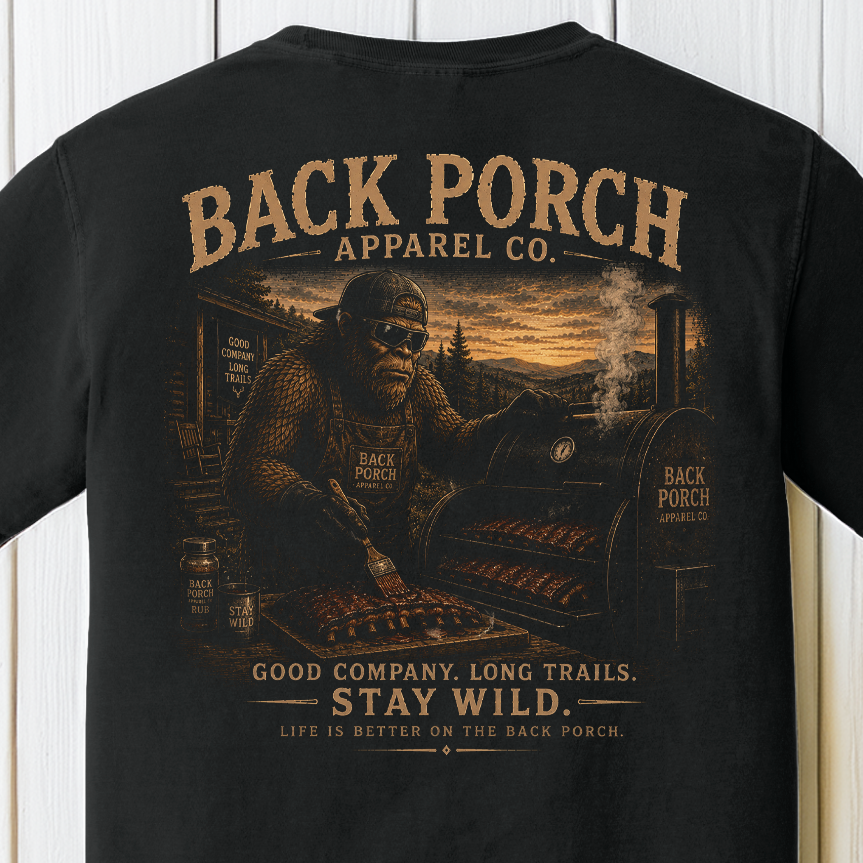 Bigfoot BBQ pitmaster graphic t-shirt on Comfort Colors garment-dyed tee featuring Sasquatch smoking barbecue