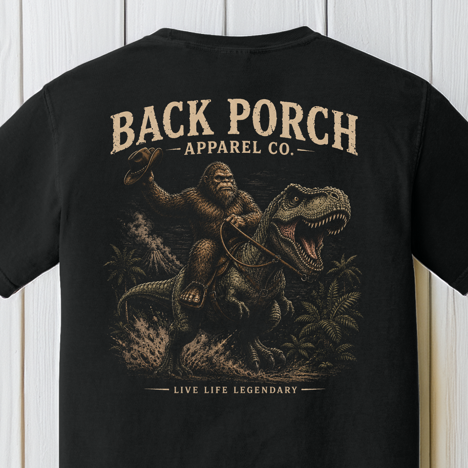 Back Porch Apparel Bigfoot Riding T-Rex Shirt Design