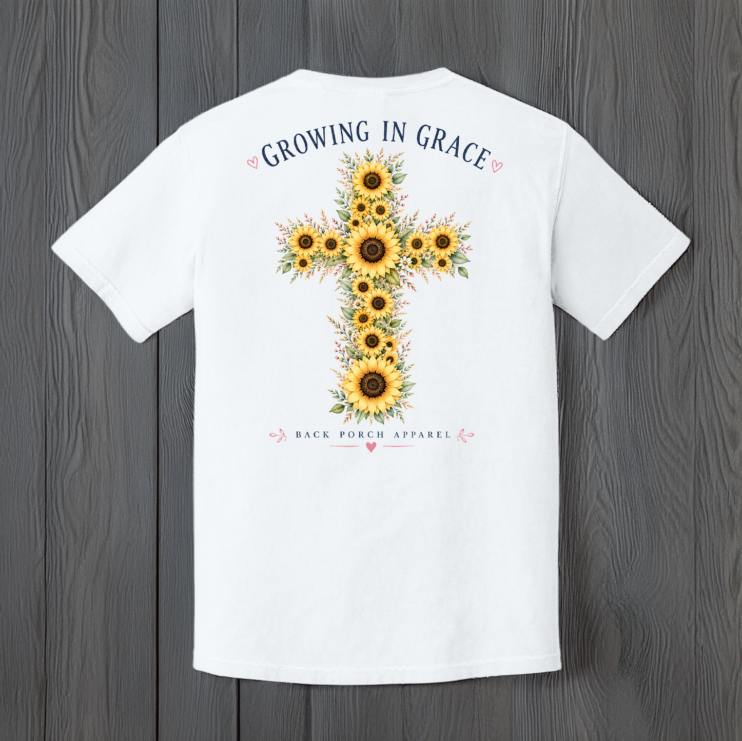 Growing In Grace graphic t-shirt featuring a large sunflower cross with floral accents and Christian faith-inspired artwork