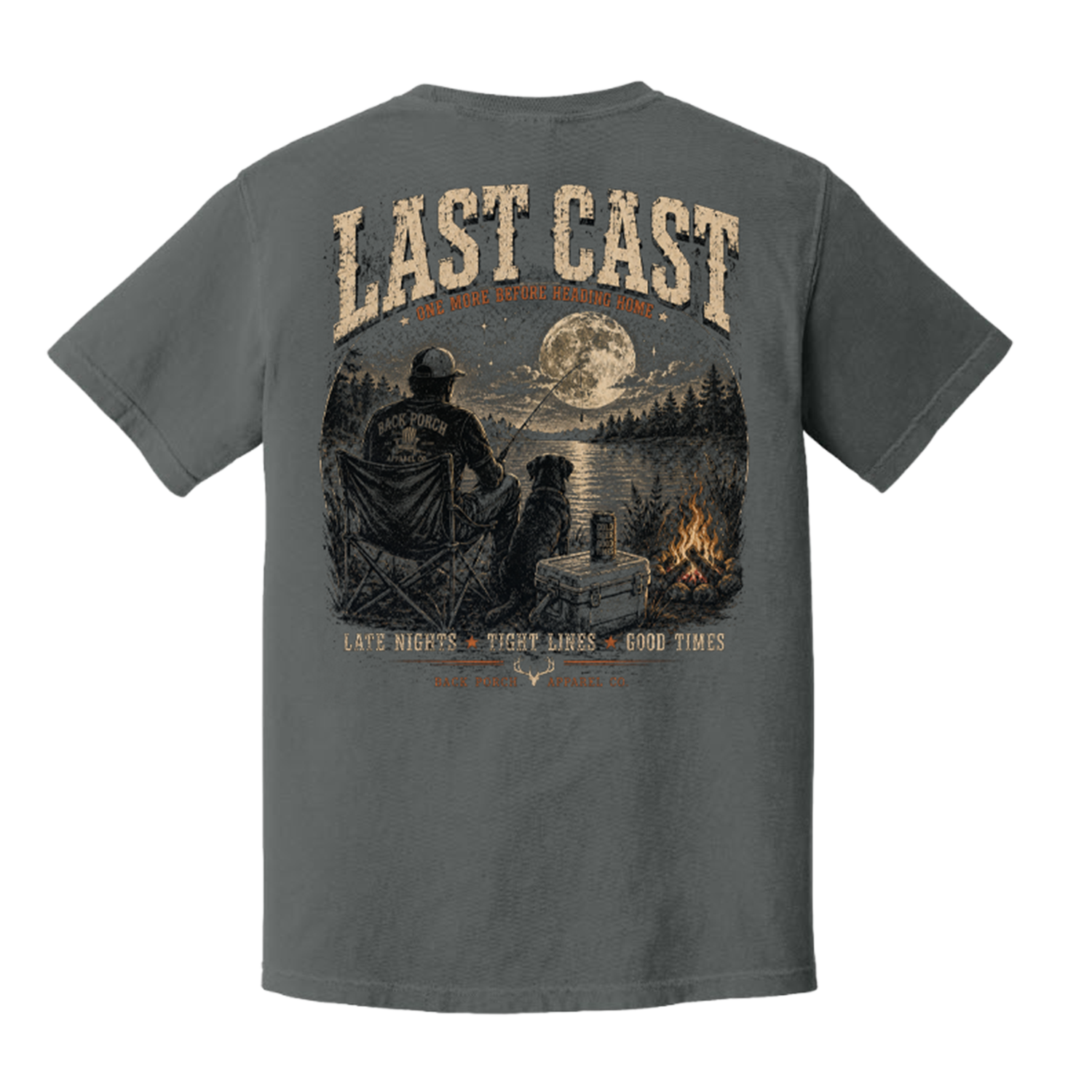 Fishing artwork on a white background featuring an angler and dog by a campfire beside a moonlit lake with Last Cast slogan. T-Shirt on Comfort Colors
