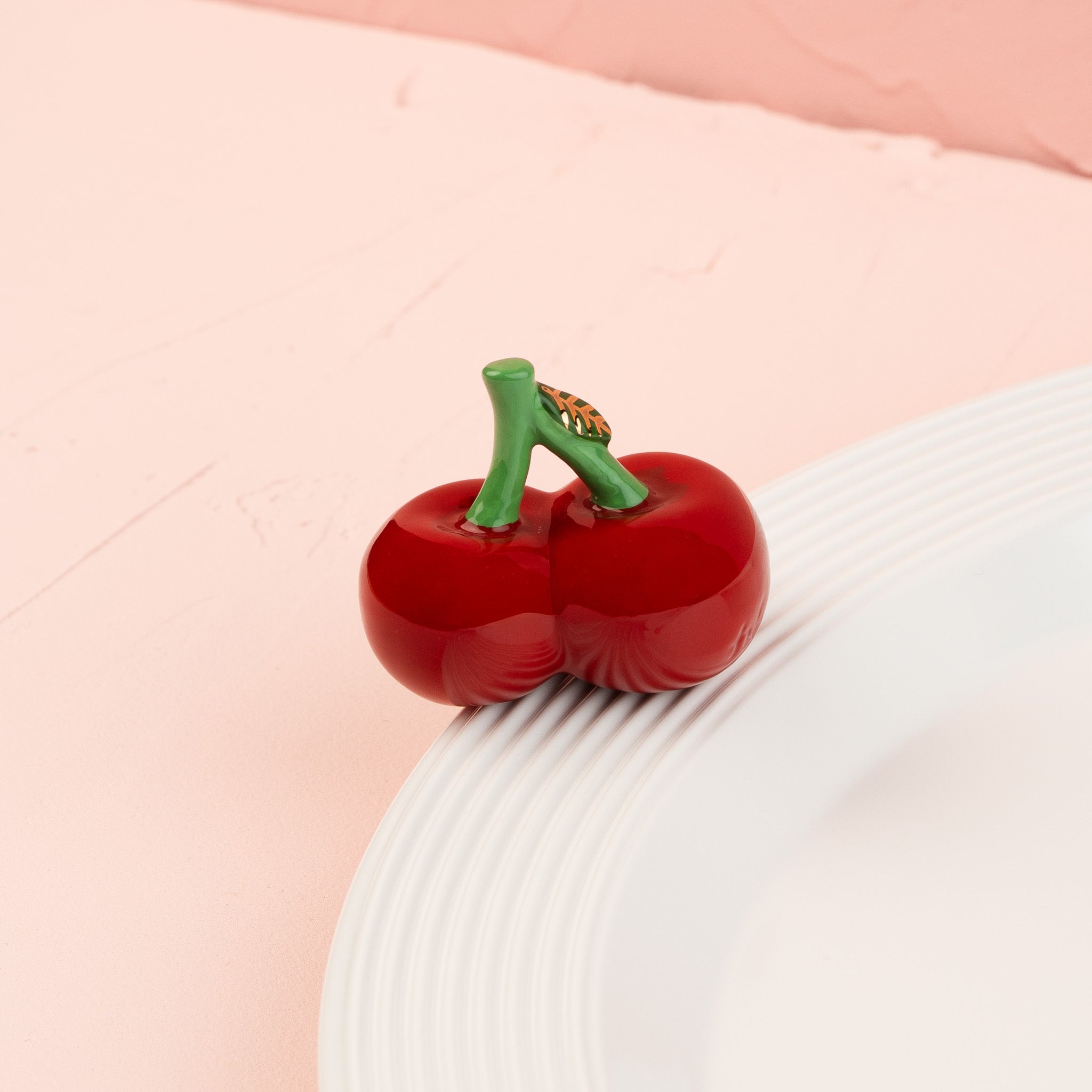 Nora Fleming Cheery Cherries Mini displayed on a white Nora Fleming platter, perfect for summer entertaining, picnics, and everyday table décor