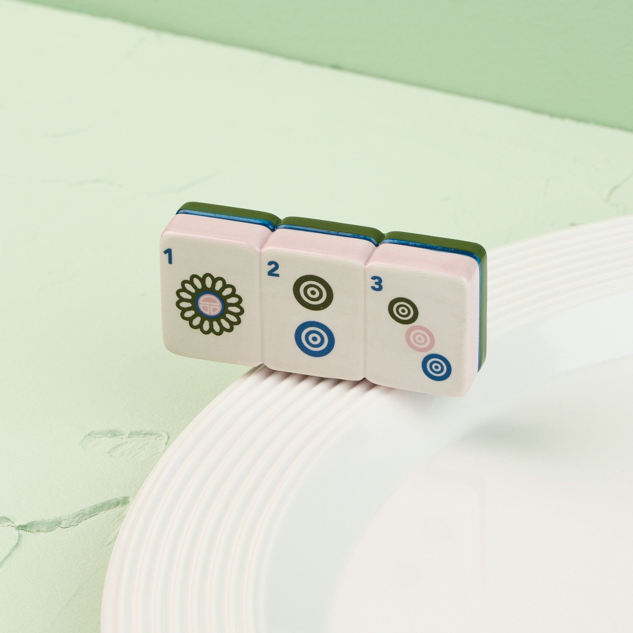 Nora Fleming Mahj-ical Mini featuring detailed Mahjong tiles displayed on a white serving piece