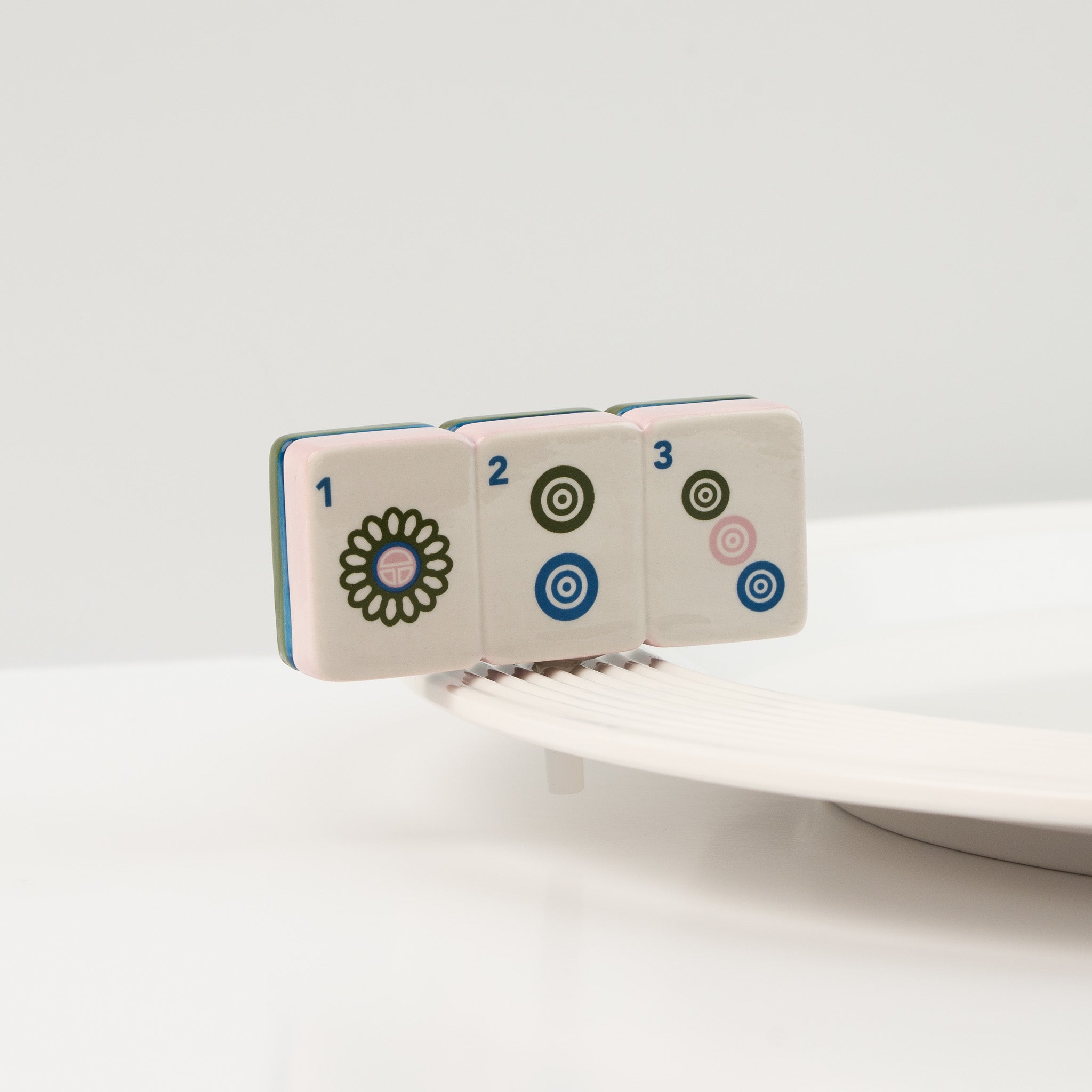 Front view of the Nora Fleming Mahj-ical Mini showcasing hand-painted Mahjong tile details