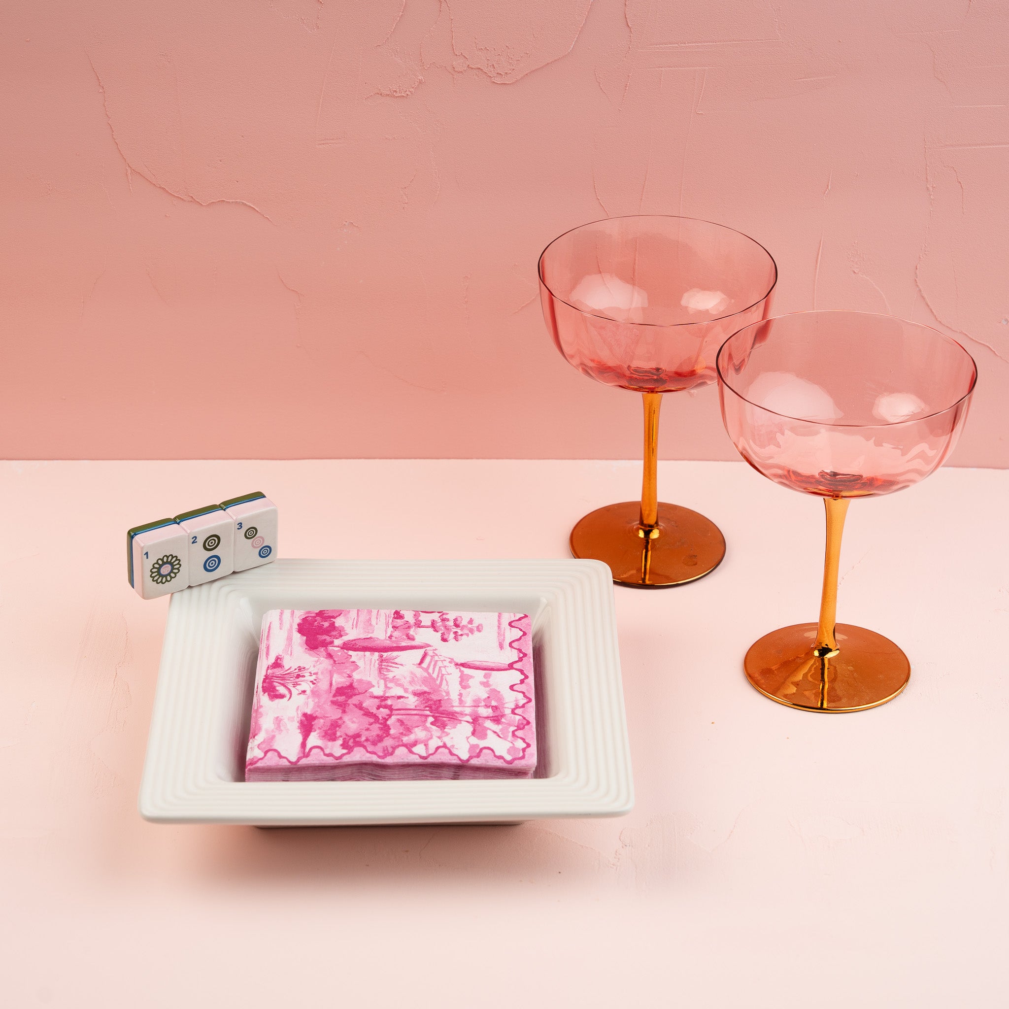 Nora Fleming Mahj-ical Mini styled with Mahjong accessories and cocktail glasses for a fun game night tablescape