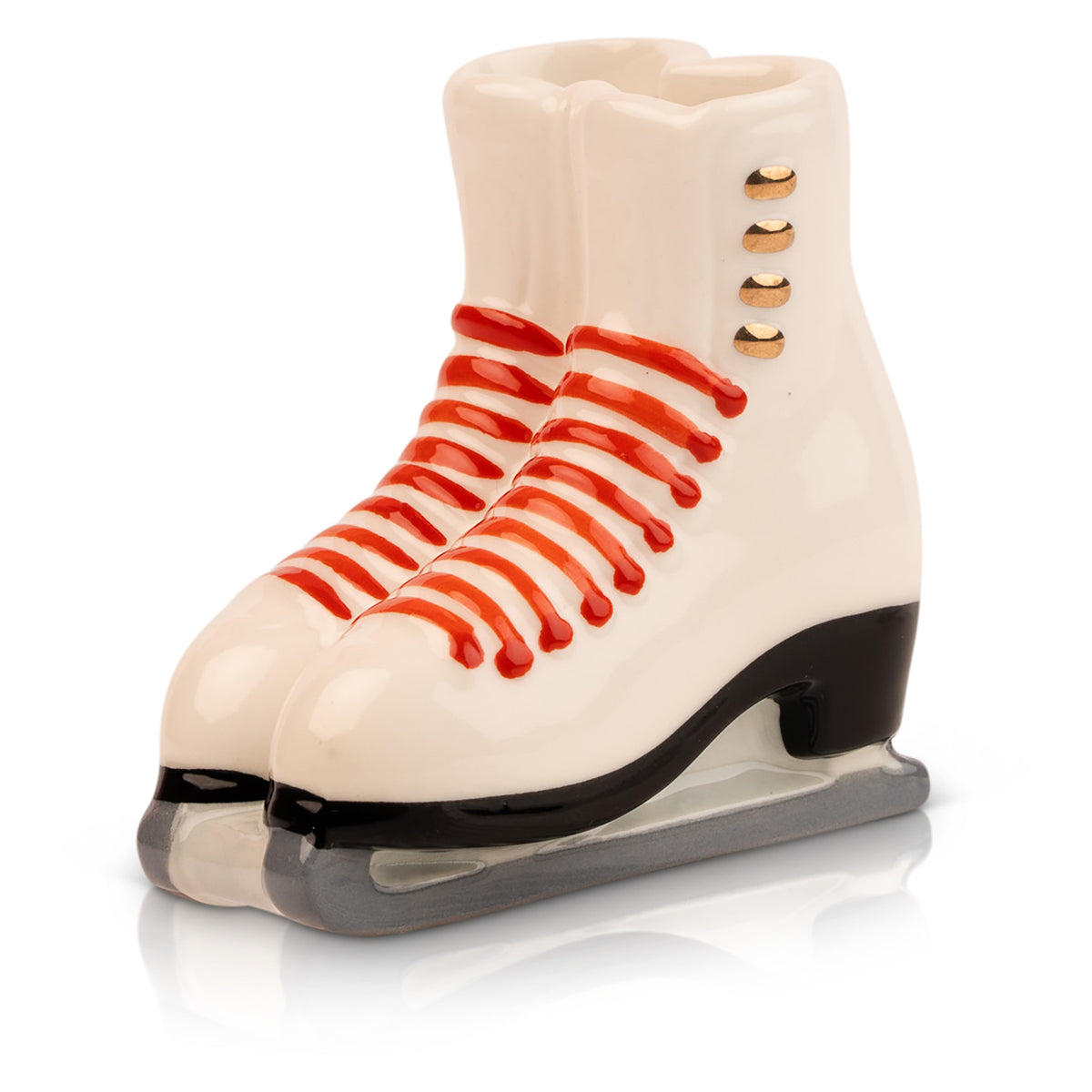 Nora Fleming Ice Skates Mini featuring white figure skates with red laces, gold buttons, black heels, and silver blades.