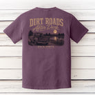Back view of the Back Porch Apparel Dirt Roads After Dark Comfort Colors Berry t-shirt featuring a vintage pickup truck, black Labrador, full moon over a lake, and distressed country graphic.