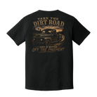 Back of Black Comfort Colors t-shirt featuring Bigfoot driving a vintage pickup truck with the words "Take the Dirt Road – Life Is Better Off the Pavement."