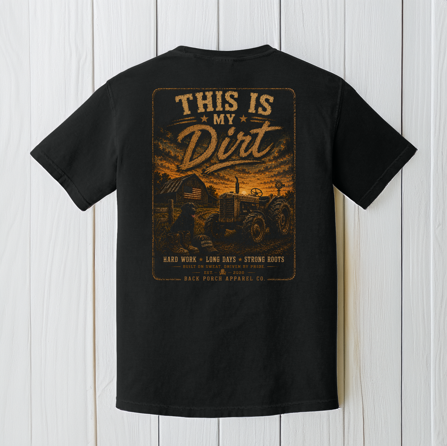 Black Comfort Colors t-shirt with a large distressed farm scene graphic on the back featuring a tractor, barn, sunset sky, and “This Is My Dirt” country slogan.