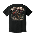 A black short-sleeve t-shirt shown from the back, featuring a large graphic print of a Santa-clad sasquatch carrying a lantern, with the text 'SANTASQUATCH' and 'BELIEVE IN CHRISTMAS LEGENDS'.