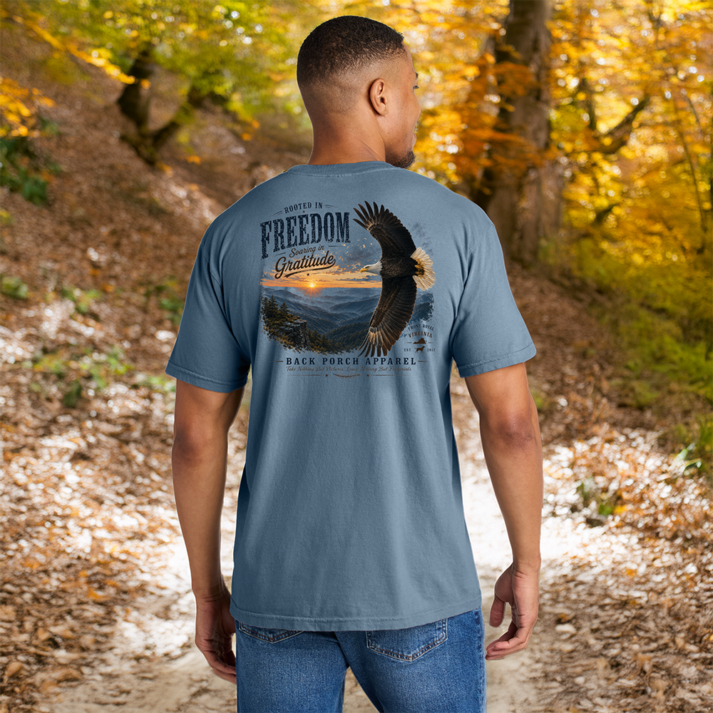 Model wearing a Back Porch Apparel Rooted in Freedom T-Shirt on Blue Jean Comfort colors