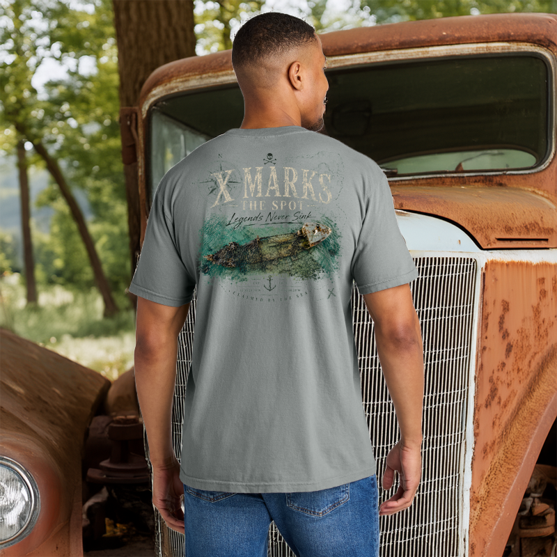 Model wearing a Back Porch Apparel X Marks The Spot Shipwreck Shirt on Comfort Colors Grey T-Shirt
