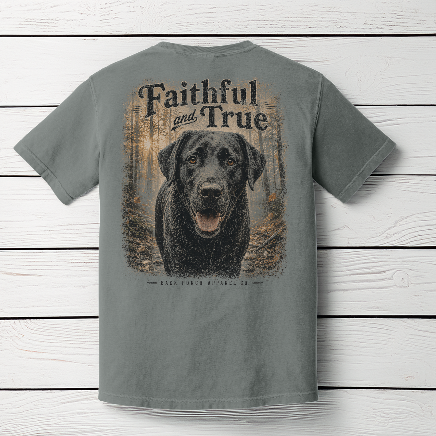 Back view of the Faithful and True Comfort Colors Grey t-shirt featuring a black Lab walking through the woods.