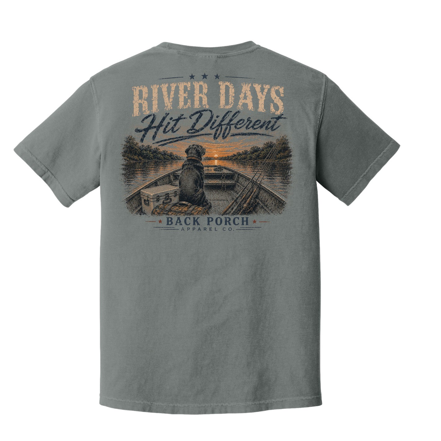 Back of a Grey Comfort Colors River Days Hit Different graphic t-shirt by Back Porch Apparel featuring a Labrador in a jon boat, fishing gear, and a peaceful sunset river landscape.