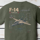 Distressed F-14 Tomcat fighter jet blueprint graphic featuring detailed military aviation schematics and tactical aircraft artwork on a Comfort Colors Moss shirt.