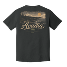 A dark charcoal gray t-shirt shown from the back, featuring a vintage-style graphic of a coastal sunset with the word 'Acadia' in a cursive font and a small bear logo below.