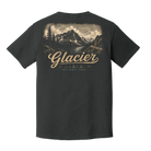 A dark charcoal gray t-shirt shown from the back, featuring a large vintage-style graphic of Glacier National Park with a mountain landscape and a tan script reading 'Glacier'.