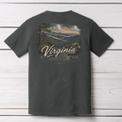 Pepper Comfort Colors Virginia Blue Ridge Rooted t-shirt displayed on a white wood background with scenic mountain artwork.