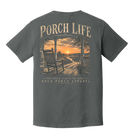 Back of Pepper Comfort Colors Porch Life t-shirt featuring a rocking chair, country porch, dirt road, and sunset with the phrase Dirt Roads Lead to the Porch.
