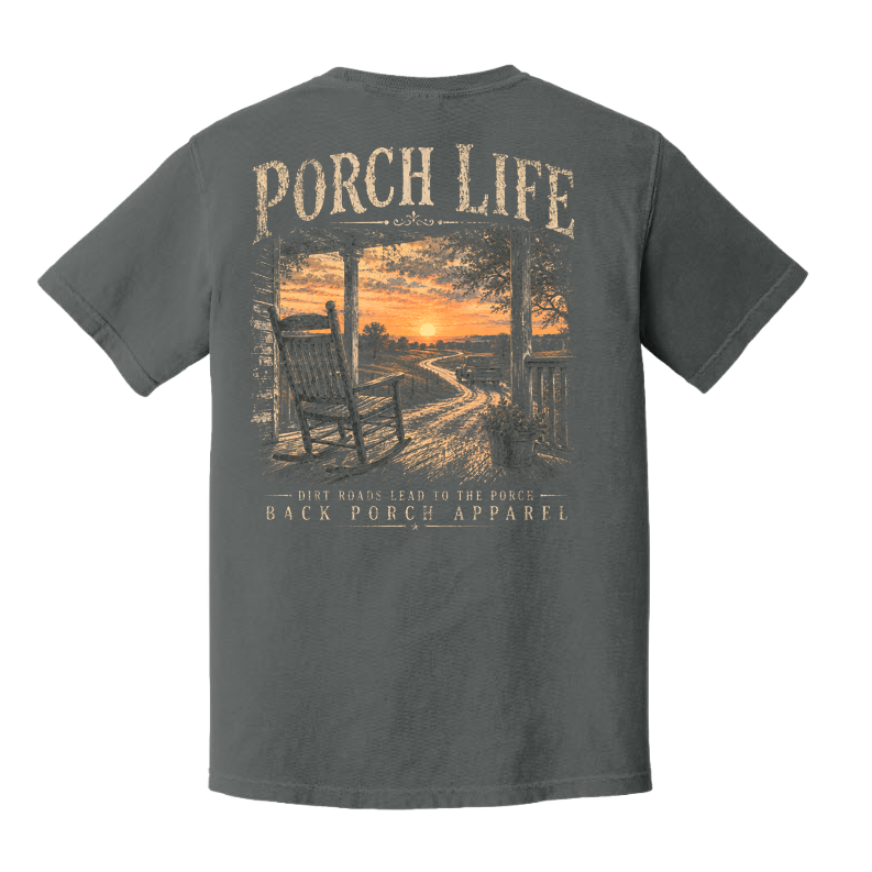 Back of Pepper Comfort Colors Porch Life t-shirt featuring a rocking chair, country porch, dirt road, and sunset with the phrase Dirt Roads Lead to the Porch.