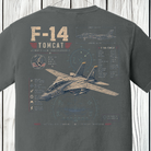 Close-up of the vintage F-14 Tomcat back graphic with aircraft illustration, flight instrument graphics, and technical specifications on a Comfort Colors Pepper t-shirt.