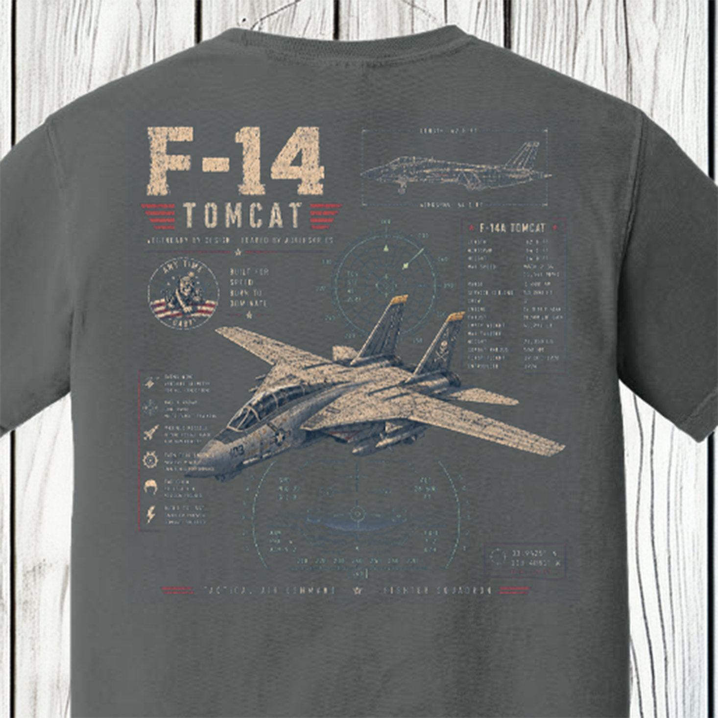 Close-up of the vintage F-14 Tomcat back graphic with aircraft illustration, flight instrument graphics, and technical specifications on a Comfort Colors Pepper t-shirt.