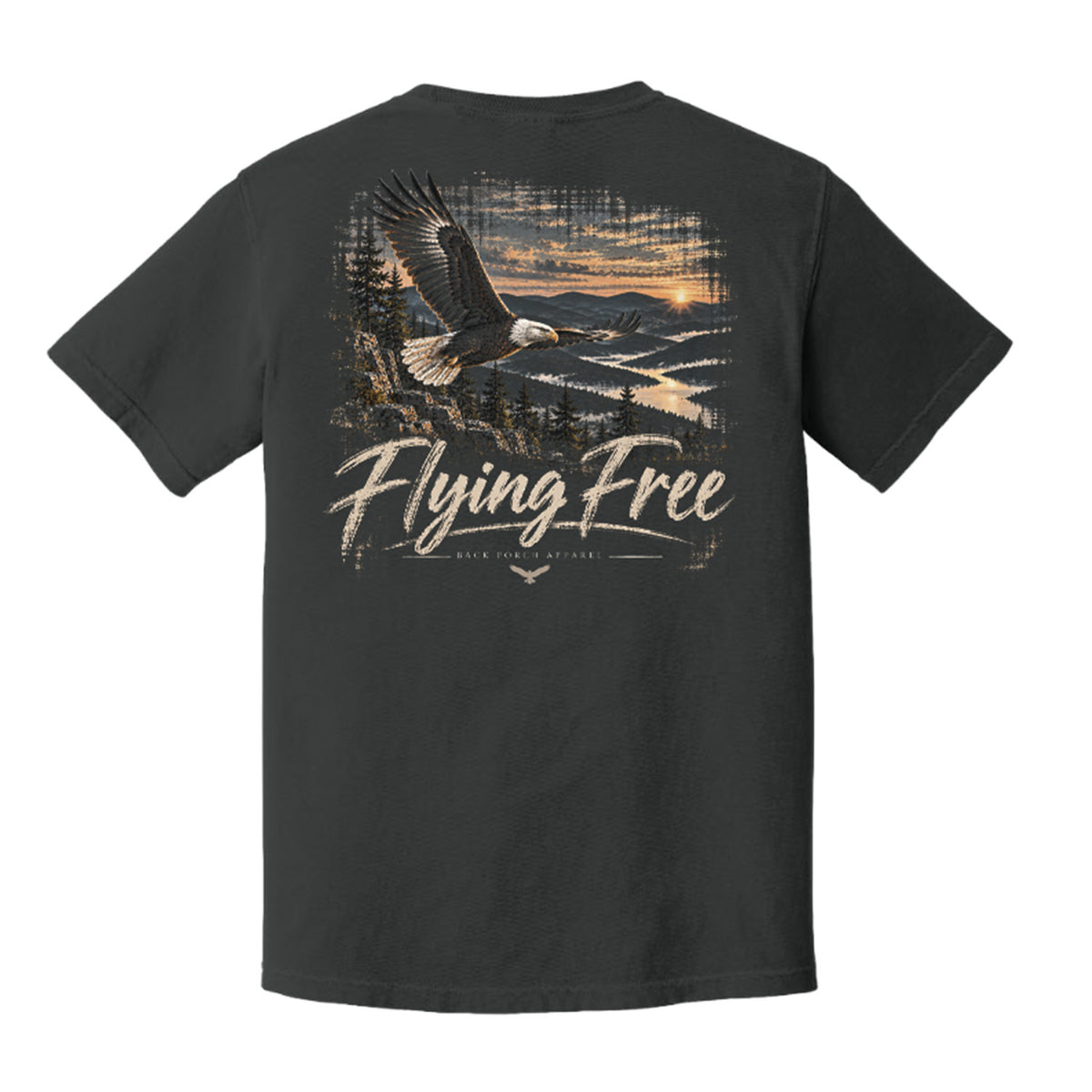 A dark charcoal gray t-shirt shown from the back, featuring a large graphic print of a bald eagle flying over a river landscape at sunset with the text 'Flying Free' and 'Menden Hosiery' printed below.