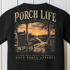 Close-up of the Porch Life Dirt Roads Lead to the Porch artwork showing a rocking chair, front porch, winding dirt road, and country sunset.