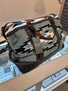 Cloud Arrow Weekender Bag: Rustic Rug, Leather, and Canvas Travel Companion