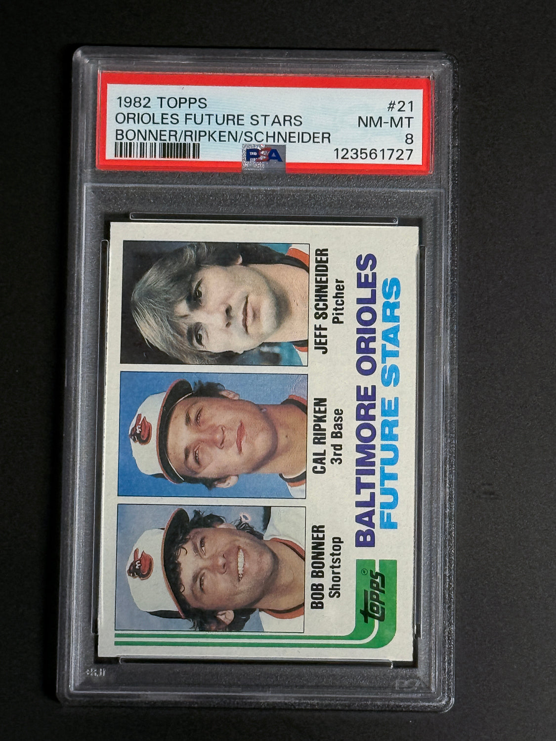 1982 Topps Orioles Future Stars #21 graded PSA 8, featuring Cal Ripken Jr., Bob Bonner, and Jeff Schneider on the front