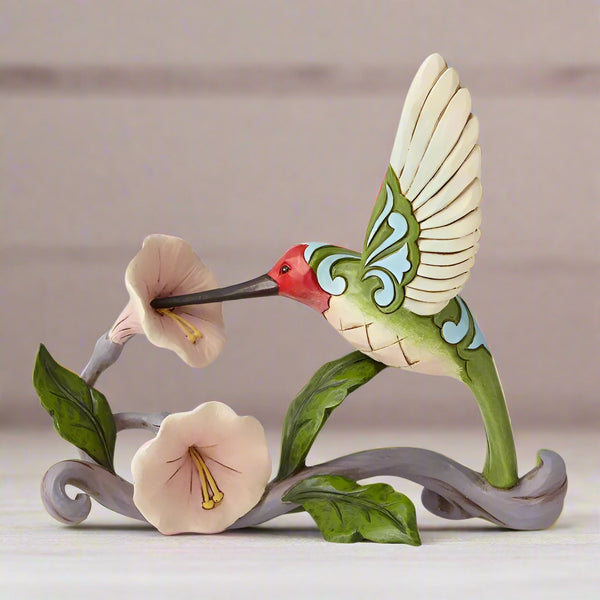 Jim Shore's Whimsical Hummingbird Haven Figurine: A Burst of Color and Craftsmanship