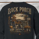 Vintage Back Porch Apparel fall design with rocking chairs, pumpkins, mums, lantern and autumn mountain view