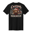 A black short-sleeve t-shirt shown from the back, featuring a large graphic print of a highland cow wearing a Santa hat in a snowy winter scene with the text 'Christmas is Better ON THE FARM' and 'Black Duck Apparel'.