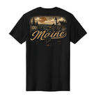 A black short-sleeve t-shirt shown from the back, featuring a large vintage-style graphic of a Maine lighthouse scene in tan and brown tones with the word 'Maine' across the center.
