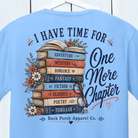 Close-up of the I Have Time for One More Chapter graphic featuring stacked books, flowers and reading-themed artwork.