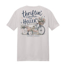 Thriftin' Through the Holler graphic printed on an ice gray super soft ring spun cotton t-shirt featuring a vintage bicycle, flowers, flea market finds, and farmhouse décor.