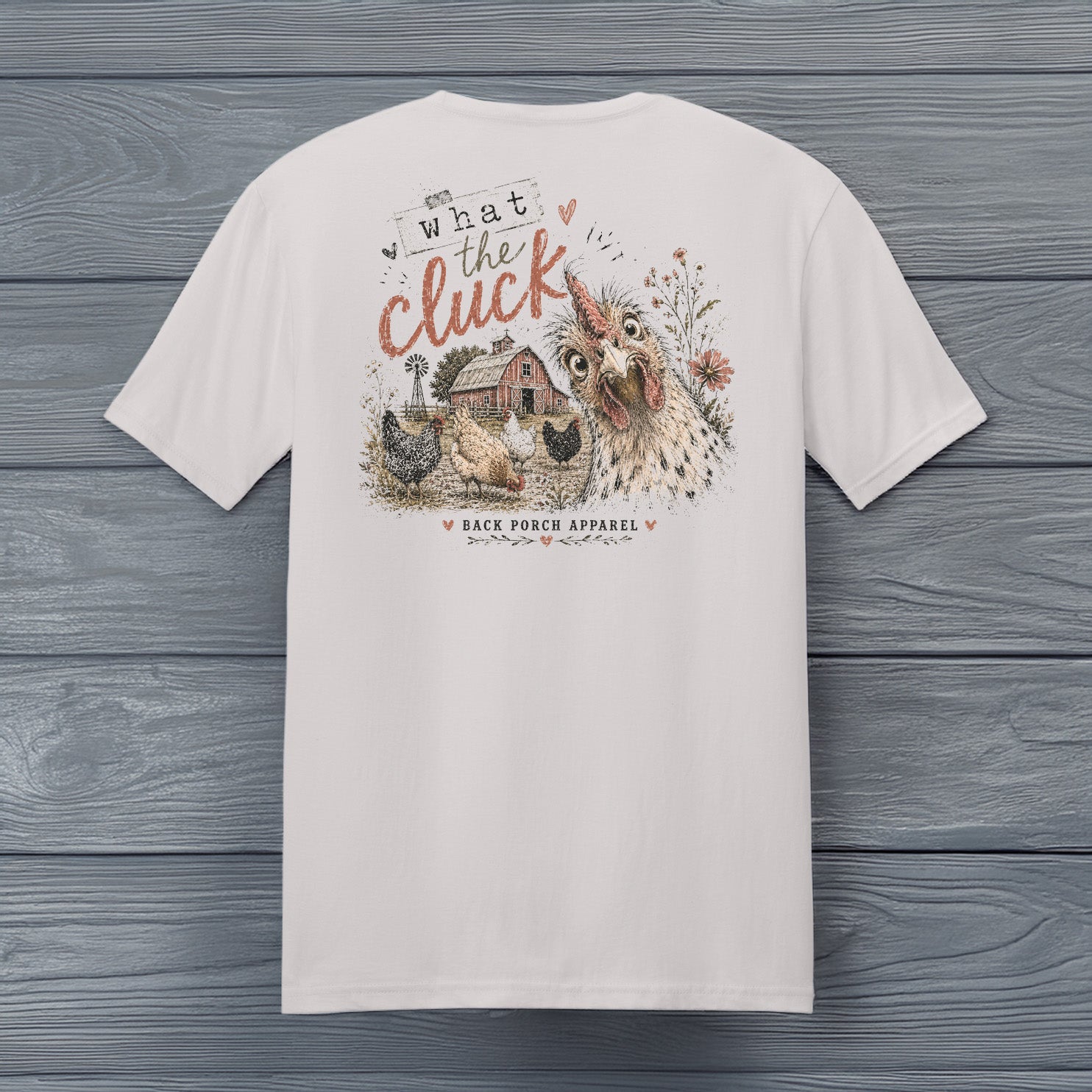 What the Cluck funny chicken graphic printed on an ice grey super soft ring spun cotton t-shirt by Back Porch Apparel.