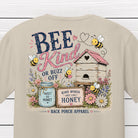 Close-up of the Bee Kind or Buzz Off design featuring smiling bees, a rustic beehive, honey jar, wildflowers and farmhouse-inspired artwork.